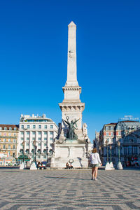 Low angle view of statue against clear blue sky