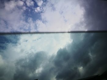 Scenic view of sea against storm clouds