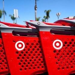 Close-up of red car against blue sky