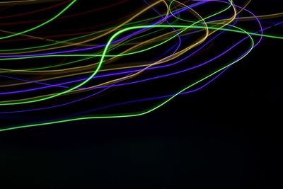 Close-up of light trails against black background