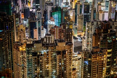 Aerial view of city lit up at night