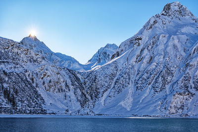 Scenic view of snowcapped mountains against sky