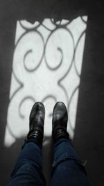 Low section of man standing on floor