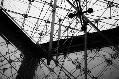 Low angle view of silhouette built structure against sky