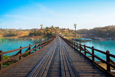 View of pier over river against sky