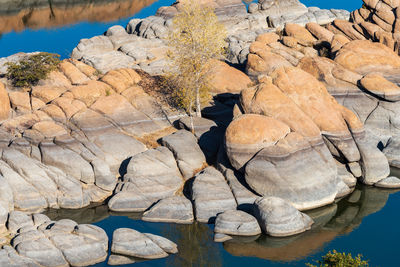 High angle view of rocks in lake during autumn