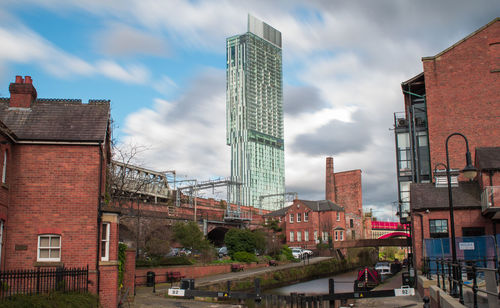 Buildings by beetham tower against sky