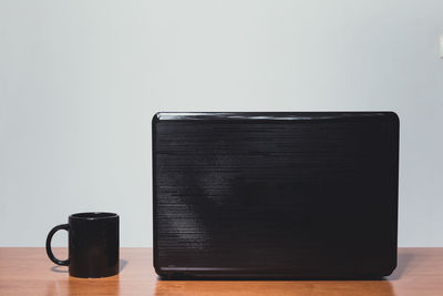 Close-up of black coffee on table against white background