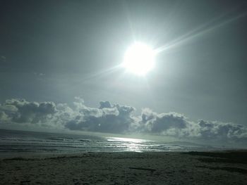 Scenic view of sea against sky on sunny day