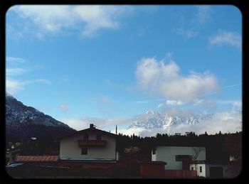 Scenic view of mountains against cloudy sky