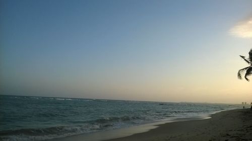 Scenic view of beach against clear sky