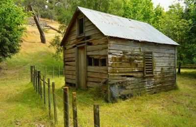 Wooden structure on grassy field