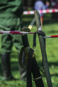 Low section of woman standing on rope