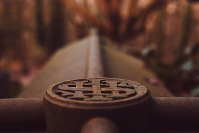 Close-up of rusty metal on table