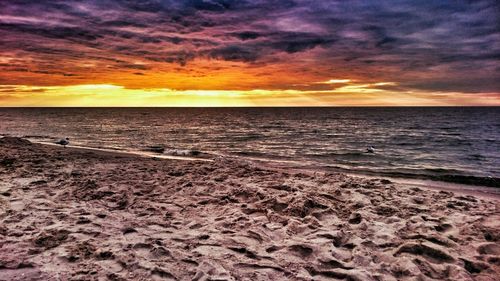 Scenic view of sea against cloudy sky