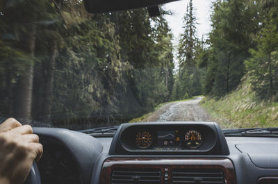 Cropped image of car on road