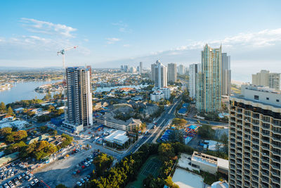 High angle view of street amidst buildings against sky