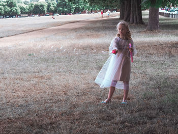 Woman standing on field