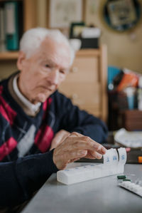 Portrait of man working on table