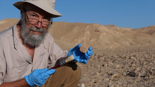 Archaeologist at work in the desert 