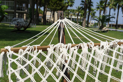 A wooden hammock standing in the center of the garden