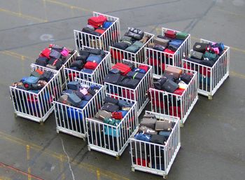 High angle view of luggage in container at dock