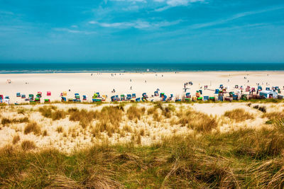 Beach with bathing vacationers on the island of juist in the north sea, germany.