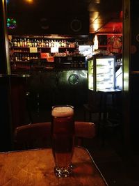 Close-up of beer glass on table