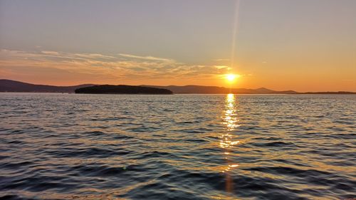 Scenic view of sea against sky during sunset