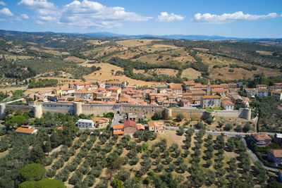 Zoomed aerial view of the medieval town of magliano in tuscany
