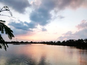 Scenic view of lake against sky during sunset