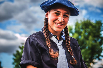 Portrait of smiling teenage girl wearing beret