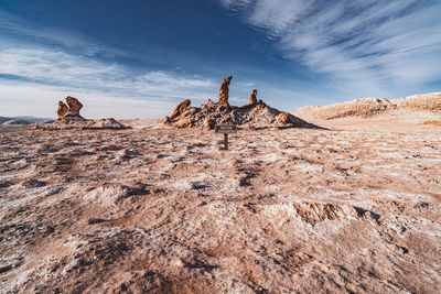 Low angle view of rock formations against sky