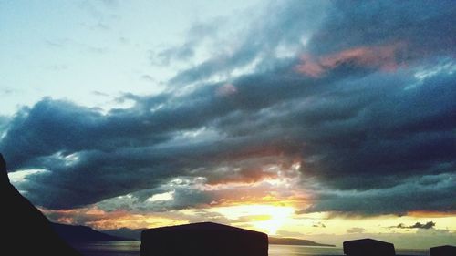 Low angle view of dramatic sky during sunset