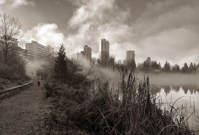 View of city against cloudy sky