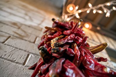 Close-up of red chili peppers on table