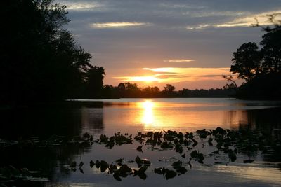 Scenic view of lake against sky during sunset