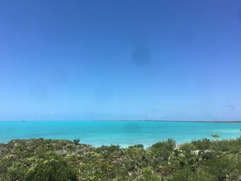 Scenic view of sea against blue sky