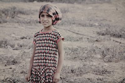 Portrait of smiling young woman in field