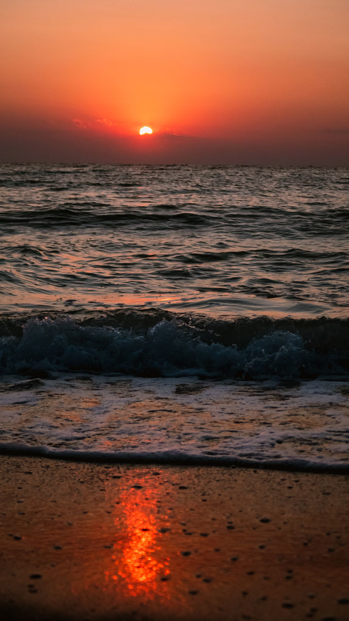 SCENIC VIEW OF SEA AGAINST ORANGE SKY