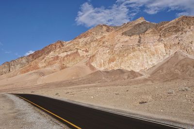 Scenic view of mountain road against sky