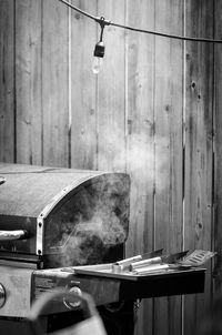 Close-up of person hand on wood