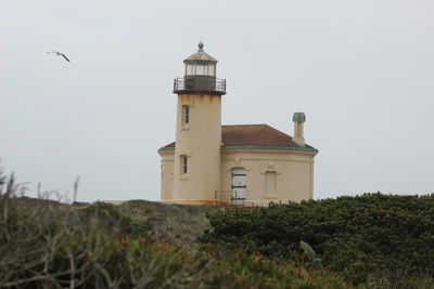 View of lighthouse on field against sky
