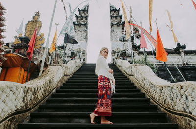 Woman standing on staircase