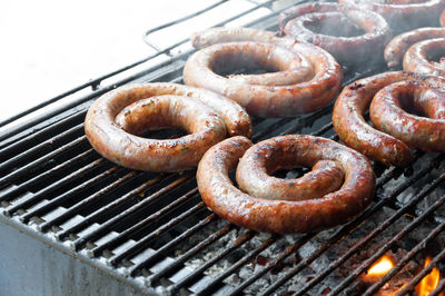 Close-up of sausages on barbecue grill