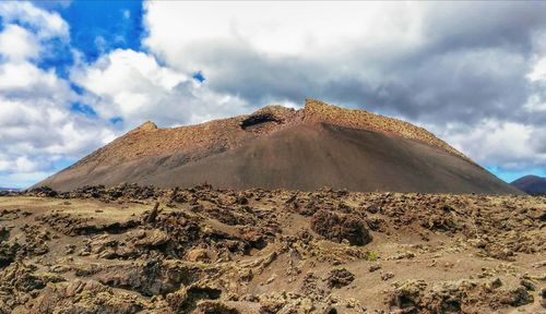 Low angle view of sand dunes in desert against sky