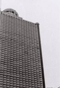 Low angle view of skyscraper against clear sky