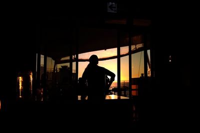 Silhouette of woman in dark background