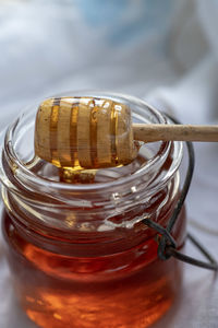 Close-up of honey  in glass jar on table