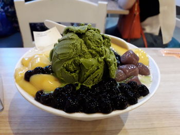 Close-up of ice cream served on table